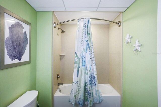 399 2nd St Unit 313, Indian Rocks Beach, FL 33785 - bathroom featuring shower / bathtub combination with curtain and toilet