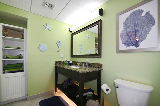 399 2nd St Unit 313, Indian Rocks Beach, FL 33785 - half bath with tile patterned floors, toilet, visible vents, and vanity