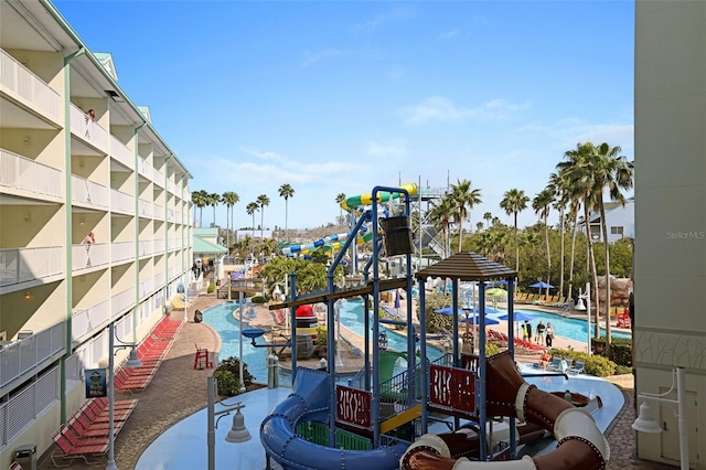 399 2nd St Unit 313, Indian Rocks Beach, FL 33785 - view of play area featuring a community pool