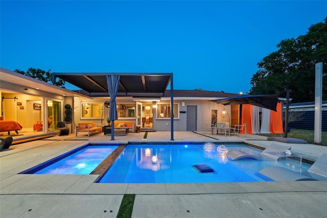 outdoor pool featuring a patio, an outdoor hangout area, and an in ground hot tub
