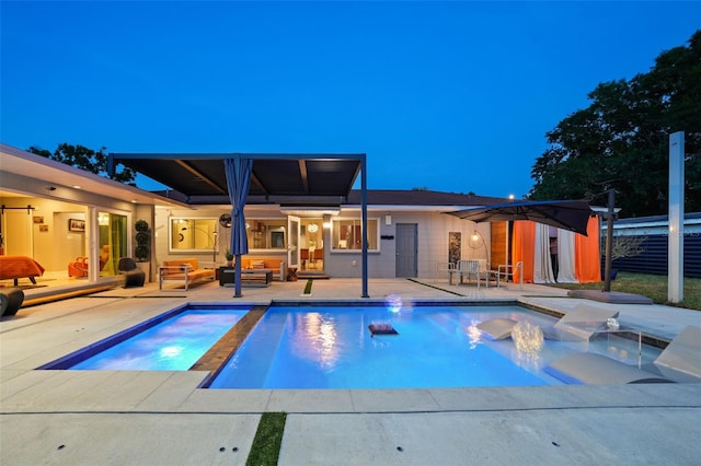 pool featuring a patio area, an in ground hot tub, and an outdoor hangout area