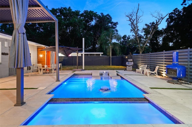 view of swimming pool featuring a patio, a fenced backyard, and a fenced in pool