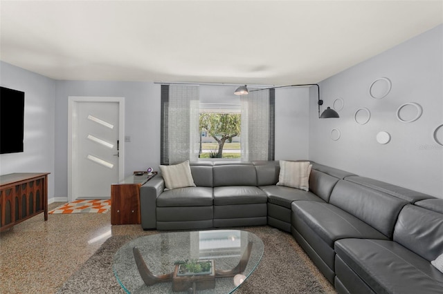 living room featuring baseboards