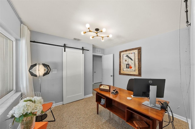 office space featuring baseboards, a barn door, and visible vents