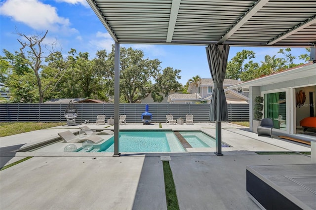 view of pool with a fenced in pool, a fenced backyard, an in ground hot tub, and a patio area