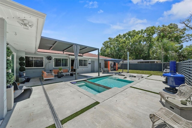 view of pool featuring an outdoor hangout area, a fenced backyard, a fenced in pool, and a patio area