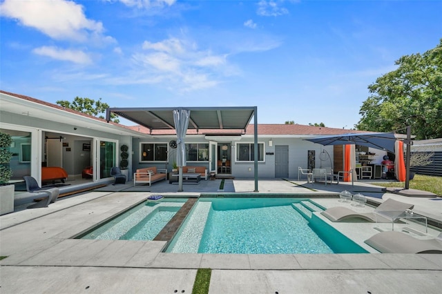 rear view of house with an outdoor pool, a patio area, an in ground hot tub, and an outdoor living space