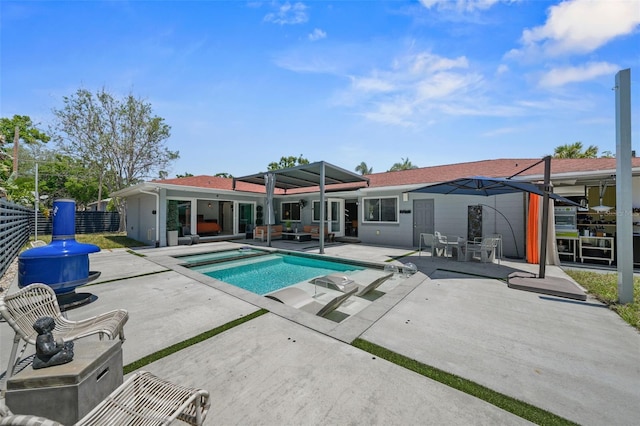 pool featuring fence and a patio