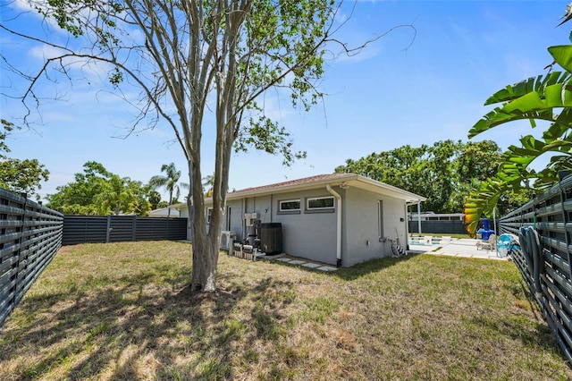 view of yard with a fenced backyard