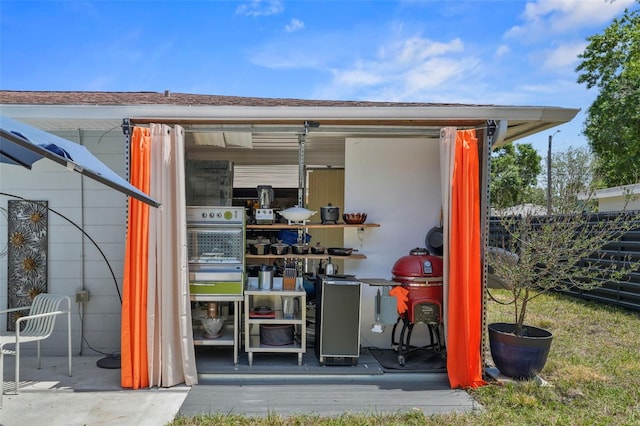 view of outbuilding with fence