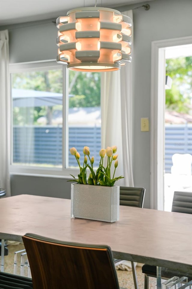 dining area with an inviting chandelier and a healthy amount of sunlight