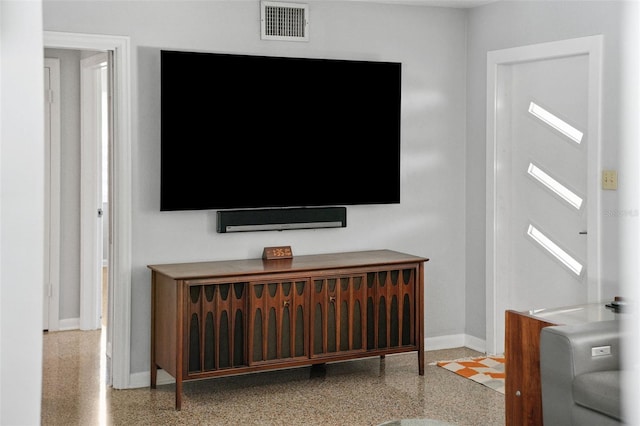 details featuring baseboards, visible vents, and speckled floor
