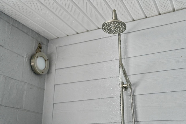 exterior details featuring a tile shower