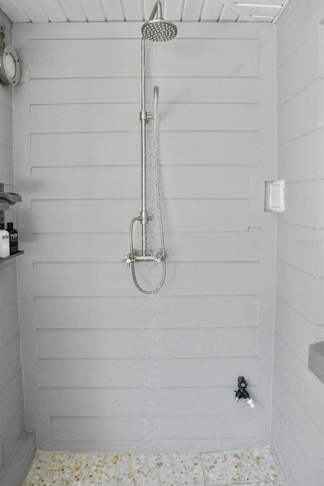 full bathroom with tiled shower
