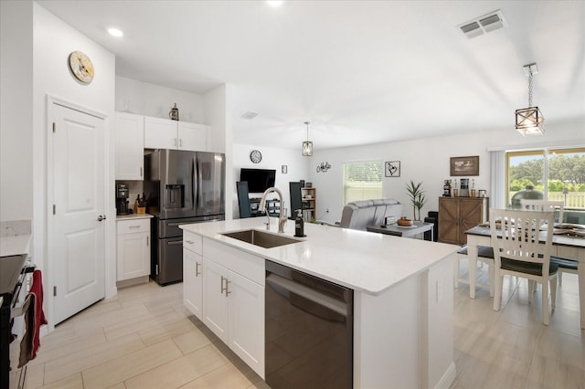 kitchen with a sink, visible vents, appliances with stainless steel finishes, and a healthy amount of sunlight