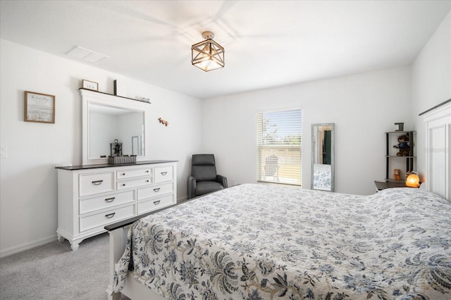 carpeted bedroom featuring baseboards