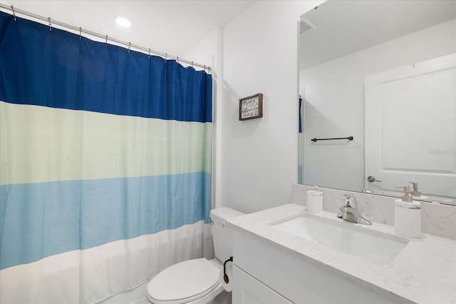 full bathroom featuring visible vents, toilet, and vanity