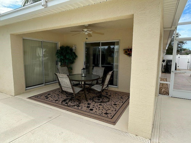 view of patio featuring ceiling fan and outdoor dining space