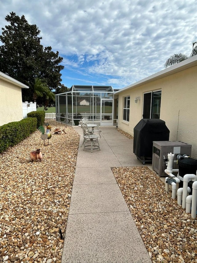 view of yard with a lanai and a patio area