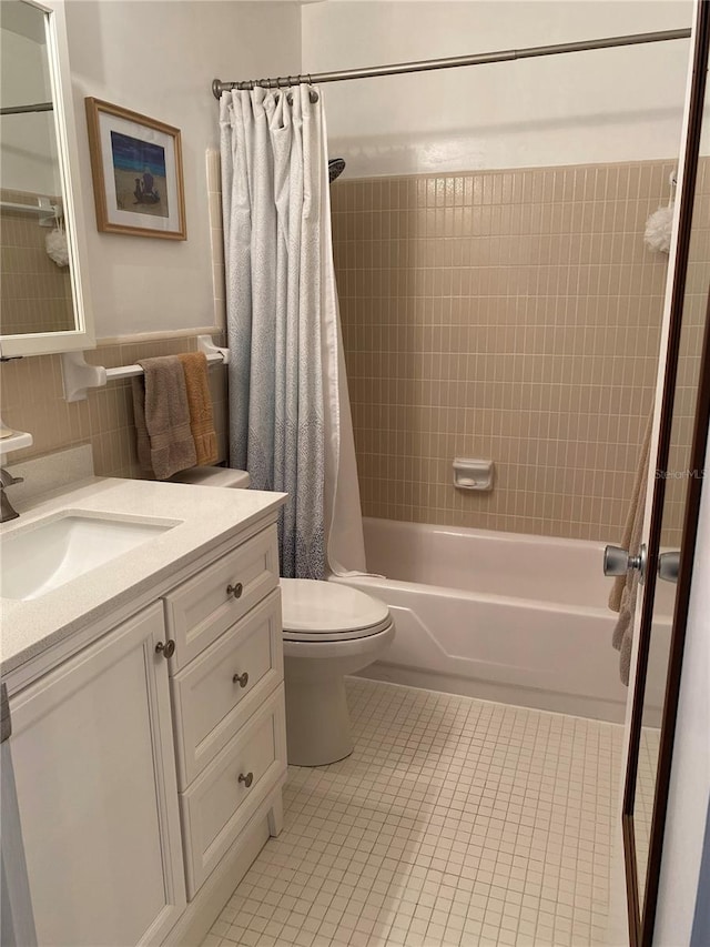 8320 112th St Unit 206, Seminole, FL 33772 - full bathroom featuring vanity, toilet, tile patterned flooring, and shower / bathtub combination with curtain