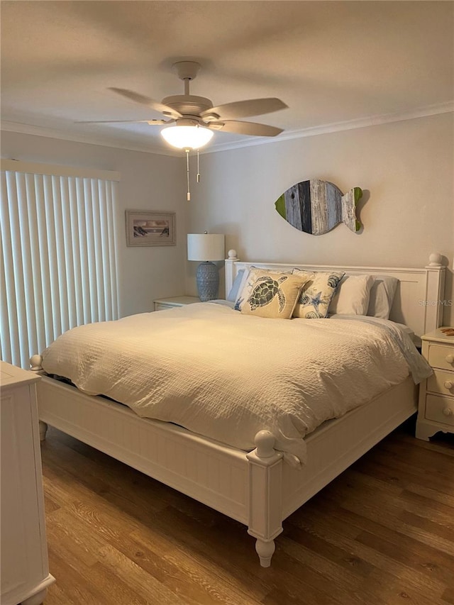 8320 112th St Unit 206, Seminole, FL 33772 - bedroom with wood finished floors, a ceiling fan, and ornamental molding