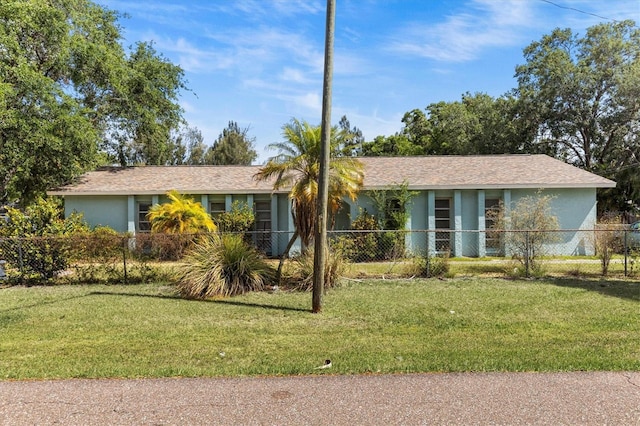 single story home with fence private yard, a front lawn, and stucco siding