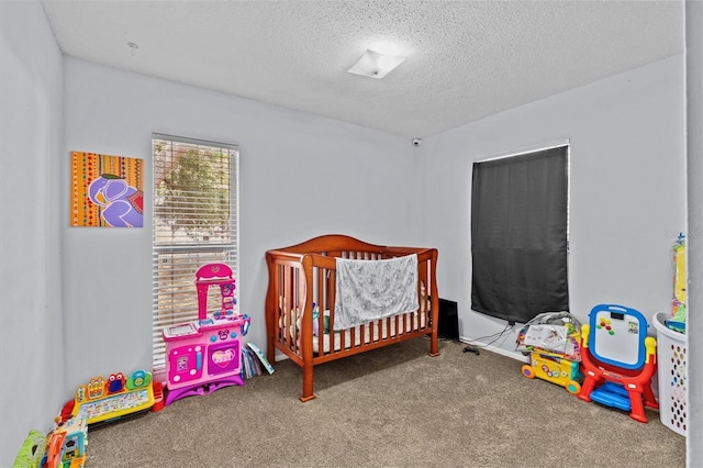 carpeted bedroom with a textured ceiling