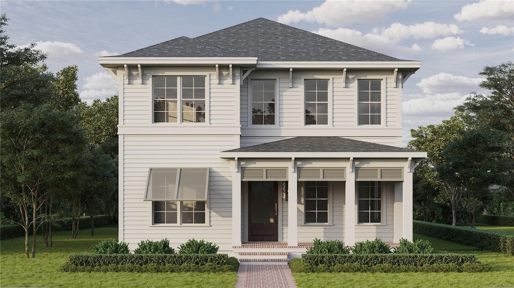 3245 11th St N, Saint Petersburg, FL 33704 - view of front of house with a shingled roof and a front lawn