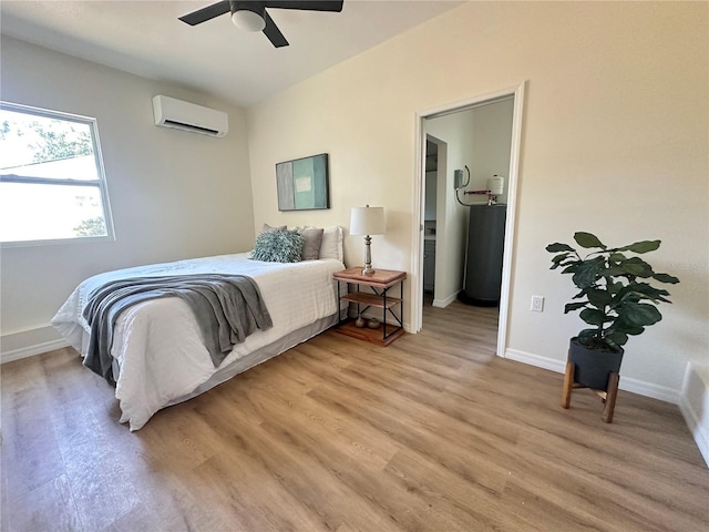 1419 55th St S, Gulfport, FL 33707 - bedroom with an AC wall unit, light wood-style flooring, baseboards, ceiling fan, and water heater