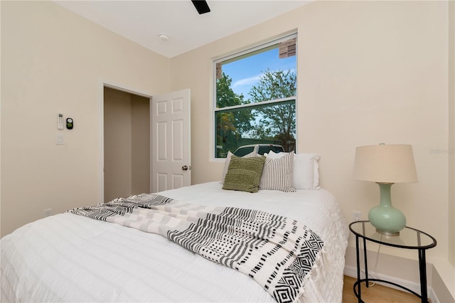 1419 55th St S, Gulfport, FL 33707 - bedroom with baseboards, ceiling fan, and wood finished floors