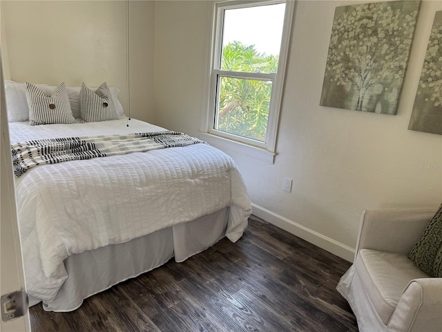 1419 55th St S, Gulfport, FL 33707 - bedroom featuring baseboards and dark wood finished floors