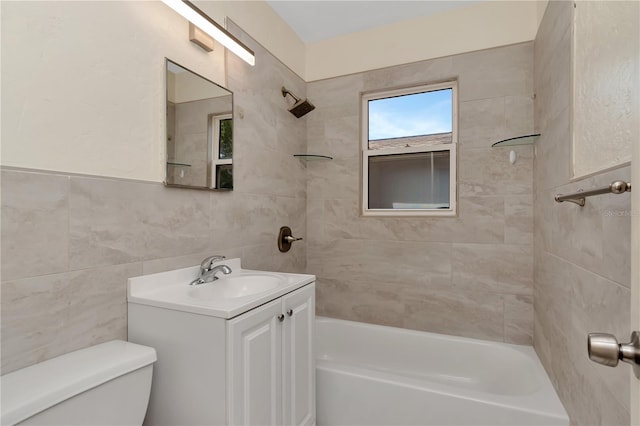 1419 55th St S, Gulfport, FL 33707 - full bath with tub / shower combination, toilet, vanity, and tile walls