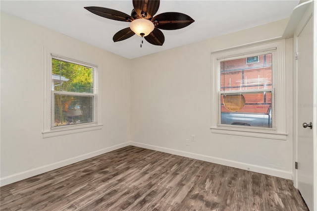 1419 55th St S, Gulfport, FL 33707 - empty room featuring wood finished floors, baseboards, and a ceiling fan