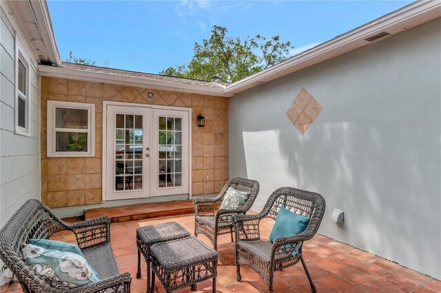1419 55th St S, Gulfport, FL 33707 - view of patio with french doors and an outdoor hangout area