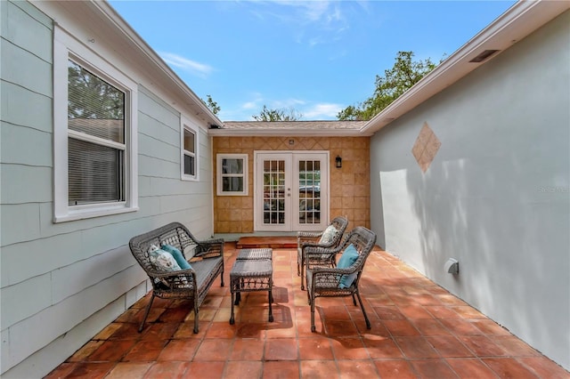 1419 55th St S, Gulfport, FL 33707 - view of patio / terrace featuring an outdoor living space and french doors