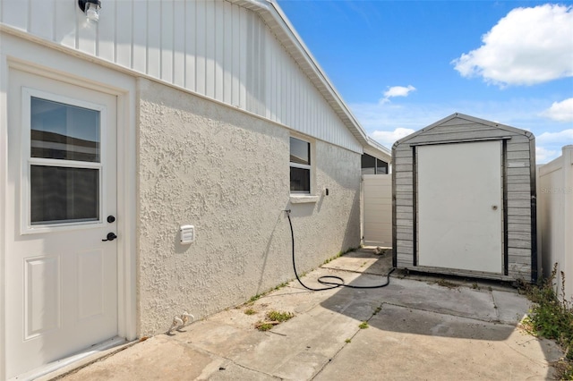 13810 Malcolm Ave, Hudson, FL 34667 - property entrance featuring stucco siding and a patio area