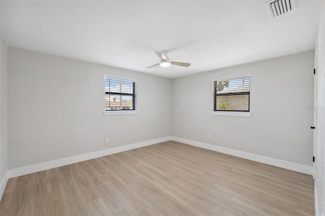 13810 Malcolm Ave, Hudson, FL 34667 - empty room with light wood-type flooring, baseboards, and ceiling fan