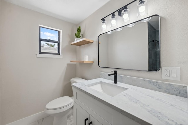 13810 Malcolm Ave, Hudson, FL 34667 - bathroom with marble look tiles, vanity, toilet, and baseboards