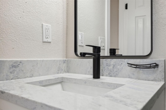 13810 Malcolm Ave, Hudson, FL 34667 - bathroom view of vanity and a textured wall