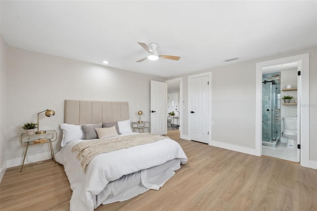 13810 Malcolm Ave, Hudson, FL 34667 - bedroom with light wood-style flooring, baseboards, ceiling fan, and connected bathroom