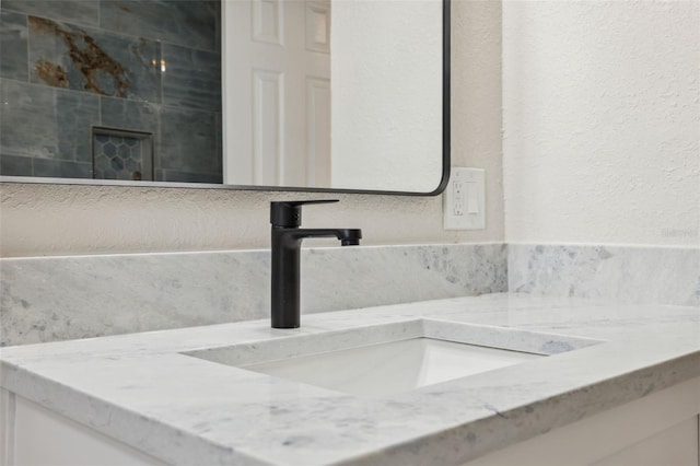 13810 Malcolm Ave, Hudson, FL 34667 - bathroom featuring vanity and a textured wall