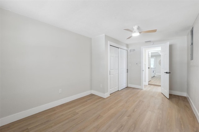 13810 Malcolm Ave, Hudson, FL 34667 - unfurnished bedroom with baseboards, light wood-style floors, a closet, and ceiling fan