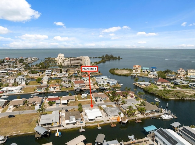 13810 Malcolm Ave, Hudson, FL 34667 - aerial view of property and surrounding area featuring a large body of water and nearby suburban area