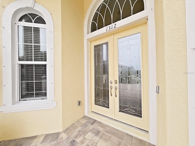 1312 Fishing Lake Dr, Odessa, FL 33556 - property entrance with french doors and stucco siding