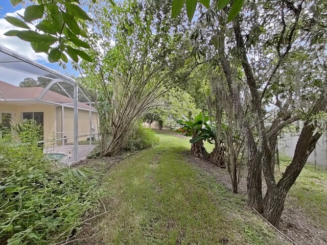1312 Fishing Lake Dr, Odessa, FL 33556 - view of yard with glass enclosure
