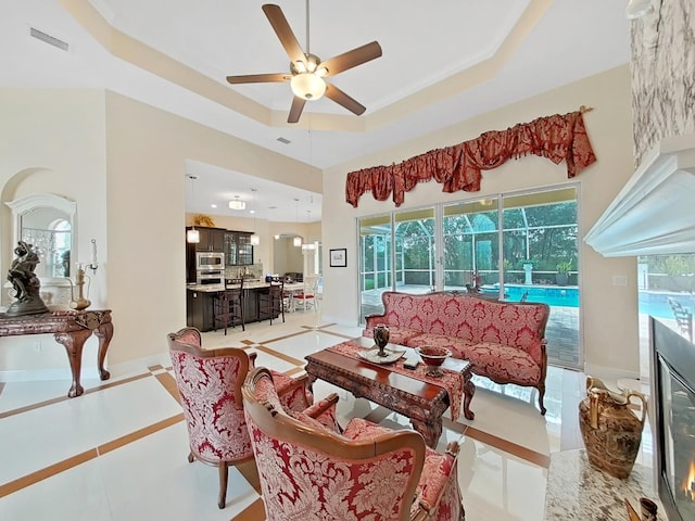1312 Fishing Lake Dr, Odessa, FL 33556 - living room with a raised ceiling, visible vents, a wealth of natural light, and ceiling fan