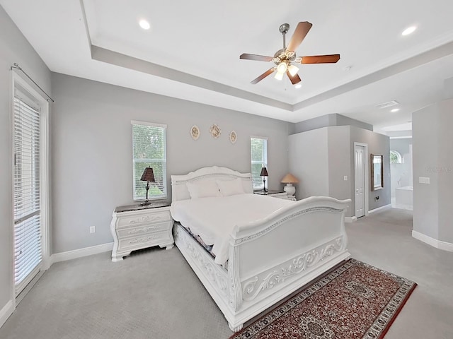 1312 Fishing Lake Dr, Odessa, FL 33556 - carpeted bedroom with ceiling fan, a tray ceiling, baseboards, visible vents, and recessed lighting
