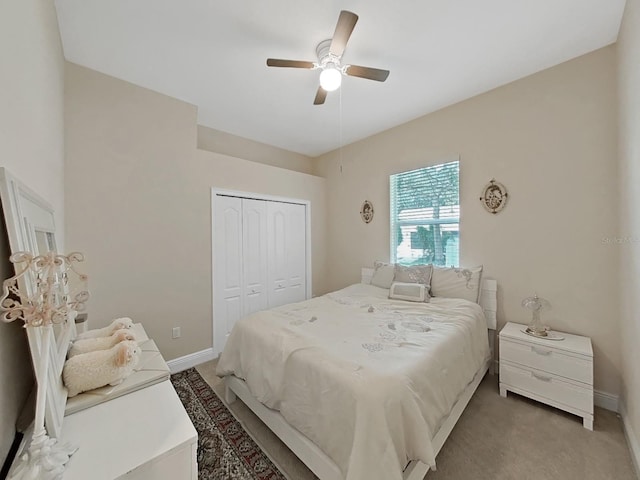1312 Fishing Lake Dr, Odessa, FL 33556 - bedroom featuring baseboards, a closet, and light colored carpet