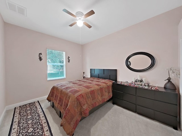 1312 Fishing Lake Dr, Odessa, FL 33556 - bedroom with baseboards, a ceiling fan, visible vents, and light colored carpet