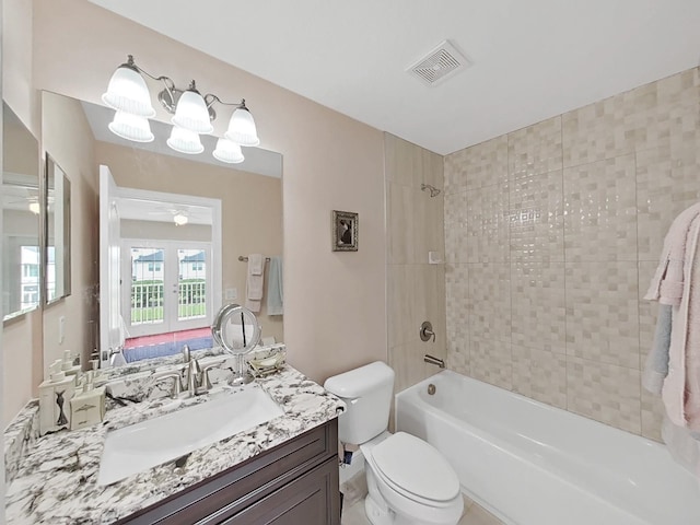 1312 Fishing Lake Dr, Odessa, FL 33556 - bathroom with vanity, ceiling fan, shower / washtub combination, toilet, and visible vents